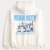 Χαλαρή μπλούζα με κουκούλα και σχέδιο Manchester City Χαλαρή μπλούζα με κουκούλα και σχέδιο Manchester City