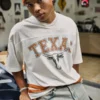 Φανέλα ποδοσφαίρου με γραφικά Longhorns του Πανεπιστημίου του Τέξας στο Ώστιν