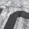 Φαρδιά μπλούζα με καμουφλάζ σχέδιο Φαρδιά μπλούζα με καμουφλάζ σχέδιο