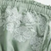 Φόρεμα babydoll χωρίς τιράντες με κεντήματα Φόρεμα babydoll χωρίς τιράντες με κεντήματα