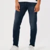 Σκούρο πλυμένο αθλητικό skinny τζιν