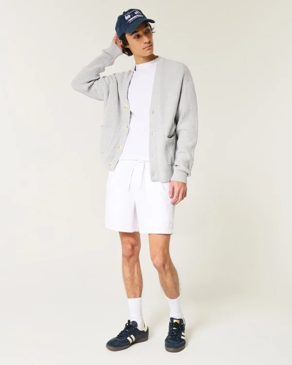 Σορτς από μείγμα λινού, μέσου μήκους, που φοριούνται χωρίς κουμπιά Σορτς από μείγμα λινού, μέσου μήκους, που φοριούνται χωρίς κουμπιά