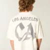 Βαρύ, φαρδύ, κοντό T-shirt με γραφικό ποδοσφαίρου Los Angeles Βαρύ, φαρδύ, κοντό T-shirt με γραφικό ποδοσφαίρου Los Angeles